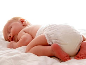 diaper baby - a sweet baby sleeping on a blanket istock - noarchive [PNG Merlin Archive]