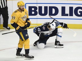 Winnipeg Jets left winger Brendan Lemieux celebrates next to Nashville Predators defenceman Roman Josi after scoring on Thursday night. (AP PHOTO)