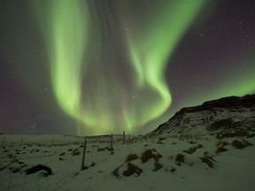 In this March 1, 2017 file photo, the Northern Lights, or aurora borealis, appear in the sky over Bifrost, Western Iceland. (AP Photo/Rene Rossignaud, File)