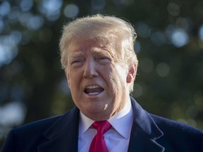 U.S. President Donald Trump speaks on the South Lawn of the White House while walking to Marine One, Sunday, Jan. 6, 2019, in Washington.