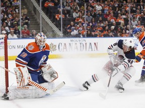 Winnipeg Jets' Brendan Lemieux (48) is stopped by Edmonton Oilers' goalie Mikko Koskinen (19) during first period NHL action in Edmonton on Monday, Dec. 31, 2018. THE CANADIAN PRESS/Jason Franson ORG XMIT: EDM103