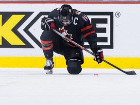 Canada's Maxime Comtois kneels on the ice after losing to Finland during overtime quarter-final world junior hockey championship action in Vancouver on Wednesday, Jan. 2, 2019.