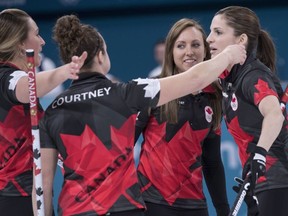 Canada's Emma Miskew, Joanne Courtney, skip Rachel Homan and Lisa Weagle, left to right, celebrate their victory over Switzerland in preliminary round in women's curling at the Pyeongchang 2018 Olympic Winter Games in Gangneung, South Korea, on Sunday, February 18, 2018.