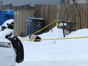 Police tape is tied to a shopping cart at the scene of a serious incident on Nairn Avenue near Allan Street in Winnipeg on Wed., Jan. 2, 2019. Kevin King/Winnipeg Sun/Postmedia Network