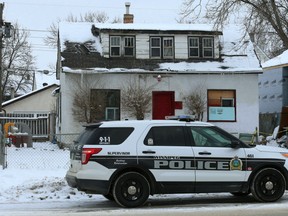 A police vehicle sits out front of the scene of a New Year's Day homicide on Nairn Avenue. Two Winnipeg men face second degree murder charges in the city's first homicide of 2019, police announced Saturday.