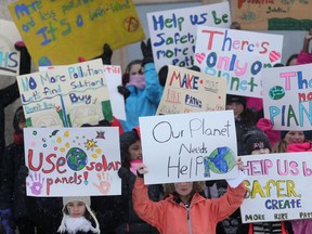 Students in Winnipeg gathered at the Legislative Building to share their opinions on various environmental issues on Friday.