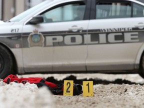 Police evidence markers at the scene of an incident in the vicinity of the 600 block of Sargent Avenue where a 26-year-old man was shot and killed in an encounter with Winnipeg police.