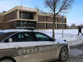 A parent arrives to pick up their child at Arthur Day Middle School on Whitehall Boulevard in Transcona on Monday. The school was placed in a hold-and-secure mode after an apparent online threat.