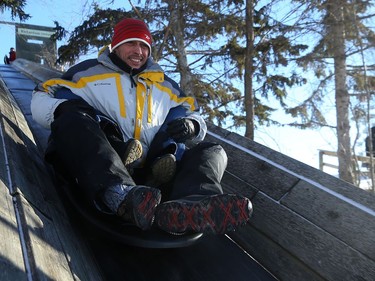 A man with another person behind him rides the giant toboggan slide during Winterfest at Fort Whyte Alive in Winnipeg on Sun., Jan. 20, 2019. Kevin King/Winnipeg Sun/Postmedia Network