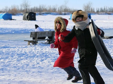 People run for the stairs to get back to the top of the toboggan slide during Winterfest at Fort Whyte Alive in Winnipeg on Sun., Jan. 20, 2019. Kevin King/Winnipeg Sun/Postmedia Network