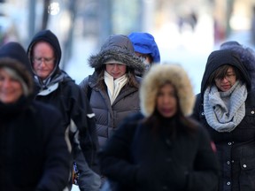 Pedestrians bundled up against freezing temperatures in Winnipeg.