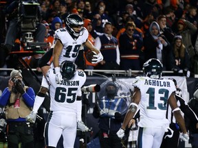 CHICAGO, ILLINOIS - JANUARY 06:  Golden Tate #19 celebrates with Lane Johnson #65 of the Philadelphia Eagles after scoring a touchdown against the Chicago Bears in the fourth quarter of the NFC Wild Card Playoff game at Soldier Field on January 06, 2019 in Chicago, Illinois.