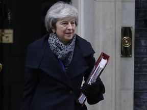 British Prime Minister Theresa May leaves 10 Downing Street in London, Wednesday, Jan. 16, 2019.
