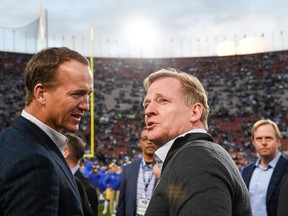 NFL Commissioner Roger Goodell and former NFL quarterback Peyton Maning talk ahead of the NFC Divisional Round playoff game between the Los Angeles Rams and the Dallas Cowboys at Los Angeles Memorial Coliseum on Jan. 12, 2019 in Los Angeles, Calif. (Kevork Djansezian/Getty Images)