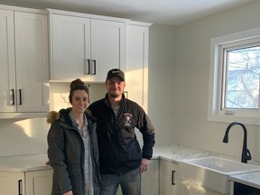 Tyler Thiessen and fiancé, Michelle Berard, pose with their new cabinets. Fehr's has been serving the Thiessen family's cabinetry needs for four generations.