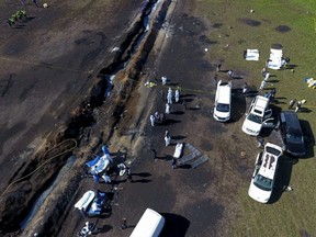 Forensic experts work the area of an oil pipeline explosion in Tlahuelilpan, Hidalgo state, Mexico, Saturday, Jan. 19, 2019.