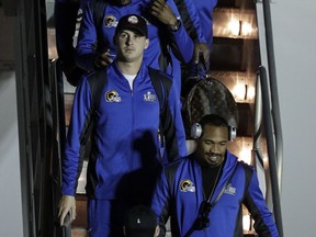 Los Angeles Rams' Jared Goff gets off the team charter as they arrive at the Hartsfield-Jackson Atlanta International Airport for the NFL Super Bowl 53 football game Sunday, Jan. 27, 2019, in Atlanta.