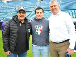 LFA president Oscar Perez, his son Jose, and CFL Commissioner Randy Ambrosie pose for a pic before the CFL Combine in Mexico City's Estadio Azul. (Dan Barnes Photo)