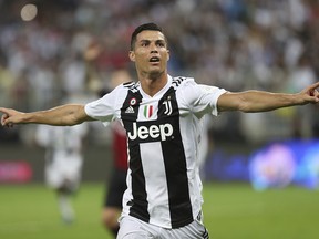 Juventus' Cristiano Ronaldo celebrates after scoring during the Italian Super Cup final against AC Milan at King Abdullah stadium in Jiddah, Saudi Arabia, Wednesday, Jan. 16, 2019. (AP Photo)