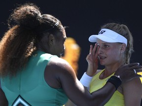Serena Williams consoles Ukraine's Dayana Yastremska after winning their third round match at the Australian Open in Melbourne, Saturday, Jan. 19, 2019.