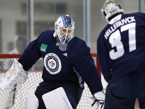 The Jets have picked up 28-year-old Swede Anton Forsberg to back up goalies Laurent Brossoit (left) and Connor Hellebuyck.