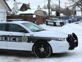 Police vehicles help form a barrier at the scene of a serious incident on Nairn Avenue near Allan Street in Winnipeg on Wed., Jan. 2, 2019. Kevin King/Winnipeg Sun/Postmedia Network