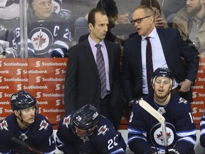 Winnipeg Jets head coach Paul Maurice (right) speaks with assistant Jamie Kompon on the bench during a break in action against the Vegas Golden Knights in Winnipeg on Tues., Jan. 15, 2019. Kevin King/Winnipeg Sun/Postmedia Network