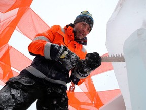 Architect Luca Roncoroni from Norway carves the Festival du Voyageur ice bar, aka the Festi-Bar, on the Assiniboine River at the Forks on Mon., Jan. 21, 2019. The bar will see action Friday, along with a 500-seat ice auditorium dubbed Pavilion Sub Zero, when the Winnipeg New Music Festival presents a concert from Norwegian musician Terje Isungset, who builds and plays instruments made of ice. Kevin King/Winnipeg Sun/Postmedia Network