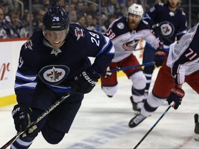 Winnipeg Jets forward Patrik Laine circles with the puck against the Columbus Blue Jackets in Winnipeg on Thursday, Jan. 30.