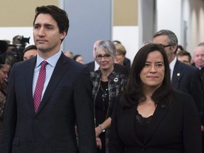 Prime Minister Justin Trudeau and former attorney general Jody Wilson-Raybould take part in the grand entrance as the final report of the Truth and Reconciliation commission is released on Dec. 15, 2015. (The Canadian Press)