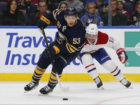 Buffalo Sabres forward Jeff Skinner (53) skates past Montreal Canadiens forward Max Domi (13) during the third period of an hockey game, Friday, Nov. 23, 2018, in Buffalo N.Y. (AP Photo/Jeffrey T. Barnes) ORG XMIT: NYJB113