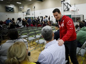 Adam van Koeverden, the Liberal candidate for Milton greets people before Prime Minister Justin Trudeau's town hall event in Milton, Ont. on Thursday, Jan. 31, 2019. THE CANADIAN PRESS/Cole Burston