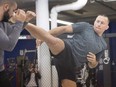 Georges St-Pierre, spars with his head trainer Firas Zahabi during a workout Wednesday, October 25, 2017 in Montreal.