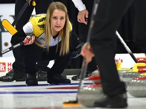 Kadriana Sahaidak watches her teammate Colton Lott sweep his rock during the gold-medal final of the 2018 Canadian Mixed Doubles Curling Championship at the Leduc Recreation Centre, April 1, 2018.