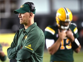 Edmonton Eskimos head coach Jason Maas and quarterback Mike Reilly (13), who was pulled in the 4th quarter as Saskatchewan Roughriders won 54-31 during CFL action at Commonwealth Stadium in Edmonton, August 25, 2017.