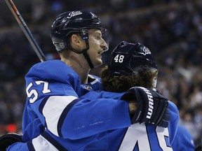 Winnipeg Jets' Tyler Myers (57) and Brendan Lemieux (48) celebrate Myers' goal against Anaheim Ducks during second period NHL action in Winnipeg on Saturday. Winnipeg's fourth line – Andrew Copp between Lemieux and Mason Appleton – has been dynamite lately.