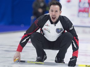 Ontario skip John Epping directs his sweepers against Team Canada at the Tim Hortons Brier at the Brandt Centre in Regina on Saturday, March 10, 2018. (THE CANADIAN PRESS/Andrew Vaughan)