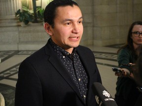 Manitoba NDP leader Wab Kinew speaks to reporters at the Manitoba Legislature on Monday. Kinew said recent nurse vacancy rates show the province should end its health facility transformation and focus on filling positions.