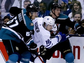Maple Leafs winger Mitch Marner is sandwiched between two Anaheim Ducks on Monday. VERONICA HENRI/TORONTO SUN