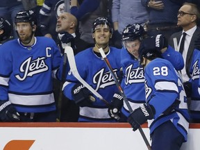 Winnipeg Jets' Jack Roslovic celebrates his hat-trick against the Anaheim Ducks Saturday night in Winnipeg. (The Canadian Press)