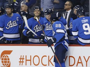 Winnipeg Jets' Jack Roslovic celebrates his hat-trick against the Anaheim Ducks last night in Winnipeg. (The Canadian Press)