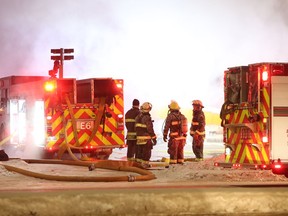 Winnipeg Fire Paramedic Service crews battle a recent fire. A Winnipeg firefighter escaped injury after being struck by a vehicle at the scene of an accident on Friday night.