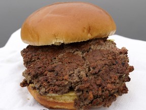 This Friday, Jan. 11, 2019 photo shows a plant-based burger made from wheat protein, coconut oil, potato protein and other ingredients in Bellevue, Neb. Released on Wednesday, Jan. 16, 2019, a report from a panel of nutrition, agriculture and environmental experts recommends a plant-based diet, based on previously published studies that have linked red meat to increased risk of health problems. (AP Photo/Nati Harnik) ORG XMIT: NY448