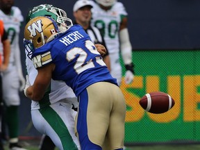 Winnipeg Blue Bombers DB Jeff Hecht sacks Saskatchewan Roughriders QB Zach Collaros, causing a fumble, in the 15th annual Banjo Bowl in Winnipeg Saturday, Sept. 8, 2018. The Bombers re-signed Canadian defensive back Hecht to a one-year contract on Sunday.