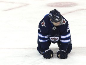 Winnipeg Jets forward Brandon Tanev grimaces after blocking a shot against the Columbus Blue Jackets in Winnipeg on Thurs., Jan. 30, 2019. Kevin King/Winnipeg Sun/Postmedia Network