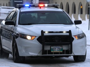 A police cruiser races east on William Avenue in Winnipeg on Mon., Feb. 4, 2019. Kevin King/Winnipeg Sun/Postmedia Network