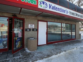 Broken glass surrounds a boarded-up door at Valentine's Fitness & Weight Loss Centre on Portage Avenue in Winnipeg on Sun., Feb. 10, 2019. Kevin King/Winnipeg Sun/Postmedia Network