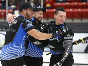 Team Carruthers skip Mike McEwen (centre), second Derek Samagalski (left) and lead Colin Hodgson celebrate their win per Team Lyburn at the 2019 Viterra provincial men's curling championship at Tundra Gas and Oil Place in Virden, Man., on Sunday, Feb. 10, 2019.