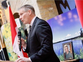 Jim Mickelson (left) speaks about his brother Bob Mickelson (pictured behind) at The Forks in Winnipeg on Monday, Feb. 18, 2019 after the Bob Mickelson Conservation Lands were announced by Nature Conservancy of Canada. The Mickelson family donated a plot of land near Riding Mountain National Park that was owned by Bob prior to his death in 2016. SCOTT BILLECK/Winnipeg Sun/Postmedia Network