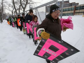 A small group of individuals walked with signs to remember Marilyn Rose Munroe on Saturday. Munroe was murdered in February 2016. On Friday, Winnipeg police appealed to the public for information on the third anniversary of her body being found in a residence on Pritchard Avenue.